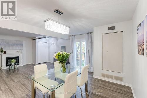 112 - 456 Janefield Avenue, Guelph, ON - Indoor Photo Showing Dining Room With Fireplace