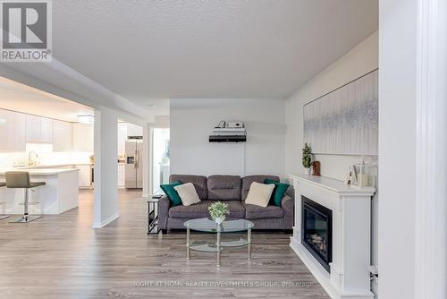 112 - 456 Janefield Avenue, Guelph, ON - Indoor Photo Showing Living Room With Fireplace