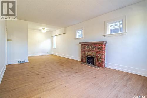 620 5Th Avenue N, Saskatoon, SK - Indoor Photo Showing Other Room With Fireplace