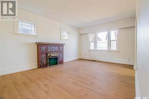 620 5Th Avenue N, Saskatoon, SK - Indoor Photo Showing Other Room With Fireplace