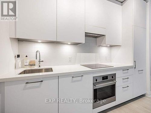 201 - 33 Frederick Todd Way, Toronto, ON - Indoor Photo Showing Kitchen With Upgraded Kitchen