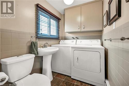 Two piece bath with laundry facilities - convenient main floor location. - 16 Harvest Lane, Brantford, ON - Indoor Photo Showing Laundry Room