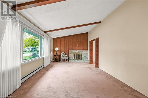 Spacious living room - 16 Harvest Lane, Brantford, ON - Indoor With Fireplace