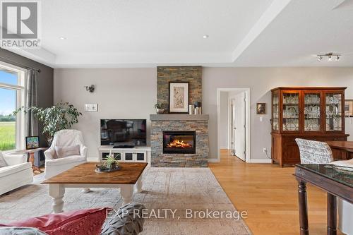 49 Maplehurst Crescent, Prince Edward County (Wellington), ON - Indoor Photo Showing Living Room With Fireplace