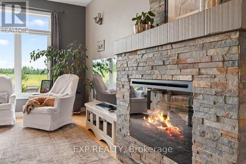 49 Maplehurst Crescent, Prince Edward County (Wellington), ON - Indoor Photo Showing Living Room With Fireplace