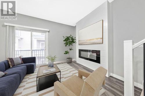 Virtual staging -- Living room - 510, 95 Skyview Close Ne, Calgary, AB - Indoor Photo Showing Living Room With Fireplace