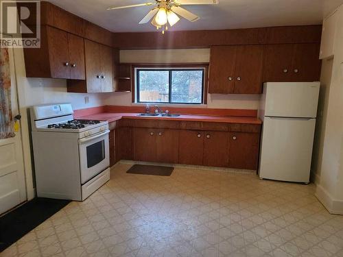 11242 91 Street, Peace River, AB - Indoor Photo Showing Kitchen With Double Sink