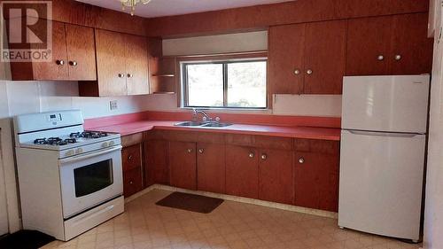 11242 91 Street, Peace River, AB - Indoor Photo Showing Kitchen With Double Sink