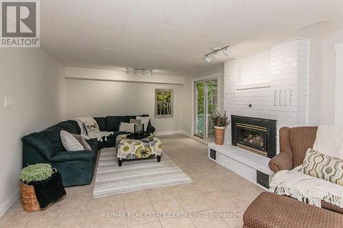 6 - 511 Oakvale Drive, Waterloo, ON - Indoor Photo Showing Living Room With Fireplace