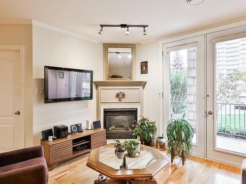 Living room - 101-3050 Boul. Notre-Dame, Laval (Chomedey), QC - Indoor Photo Showing Living Room With Fireplace