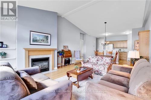 120 Passageway, Ottawa, ON - Indoor Photo Showing Living Room With Fireplace