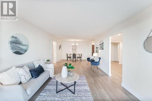 611 - 2350 Bridletowne Circle, Toronto, ON - Indoor Photo Showing Living Room