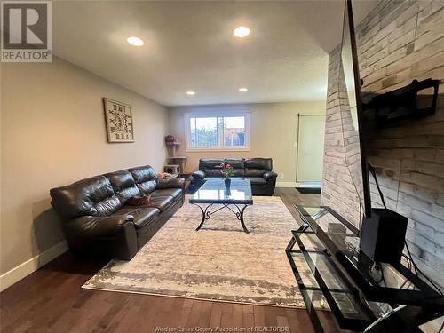 9985 Forest Glade Court, Windsor, ON - Indoor Photo Showing Living Room With Fireplace