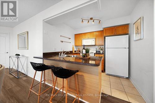 702 - 4080 Living Arts Drive, Mississauga, ON - Indoor Photo Showing Kitchen With Double Sink