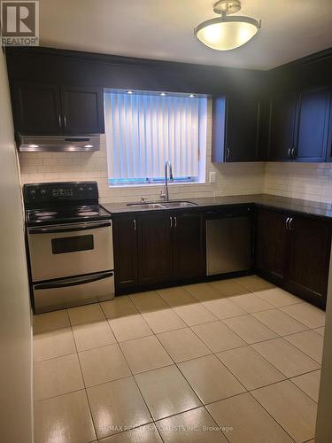 203 - 115 Hillcrest Avenue, Mississauga, ON - Indoor Photo Showing Kitchen With Double Sink