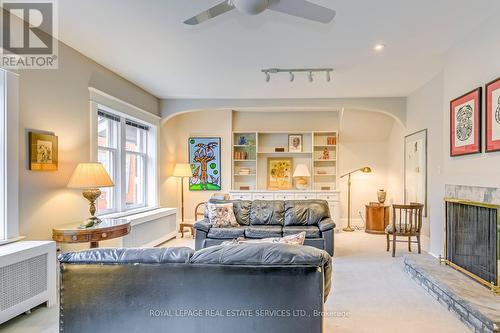 1 - 63 High Park Boulevard, Toronto, ON - Indoor Photo Showing Living Room With Fireplace