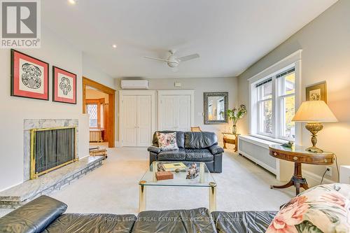 1 - 63 High Park Boulevard, Toronto, ON - Indoor Photo Showing Living Room With Fireplace