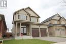 Craftsman house featuring a front lawn, a garage, and a porch - 96 Elliot Avenue E, Fergus, ON  - Outdoor With Facade 