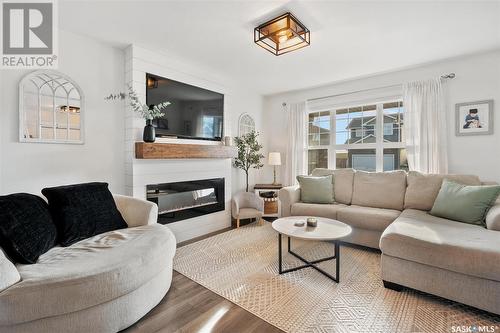 734 Kolynchuk Court, Saskatoon, SK - Indoor Photo Showing Living Room With Fireplace