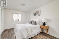 Bedroom featuring wood-type flooring - 