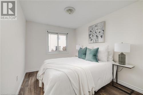 Bedroom featuring dark hardwood / wood-style flooring - 169 Bismark Drive Unit# 32, Cambridge, ON - Indoor Photo Showing Bedroom