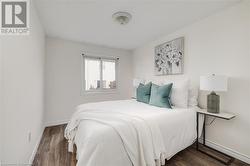 Bedroom featuring dark hardwood / wood-style flooring - 