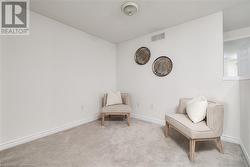 Living area featuring light carpet - 