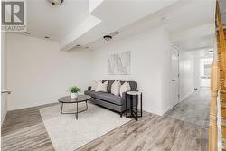 Living room featuring hardwood / wood-style flooring - 