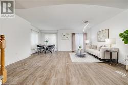 Living room featuring light hardwood / wood-style flooring - 