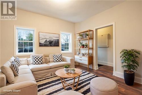 Living room with dark wood-type flooring - 19 Strachan Street E, Hamilton, ON 