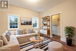 Living room with dark wood-type flooring - 