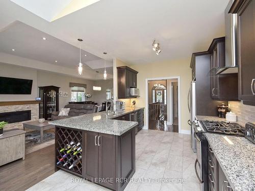 50 Hillcrest Dr, New Tecumseth, ON - Indoor Photo Showing Kitchen With Fireplace With Upgraded Kitchen