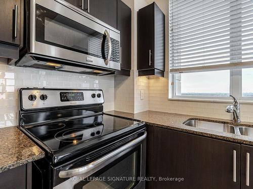 1605-9500 Markham Rd, Markham, ON - Indoor Photo Showing Kitchen With Double Sink