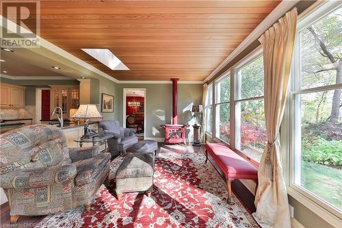 Sunroom with light wood-type flooring, a skylight, and a healthy amount of sunlight - 218 Northshore Boulevard W, Burlington, ON 