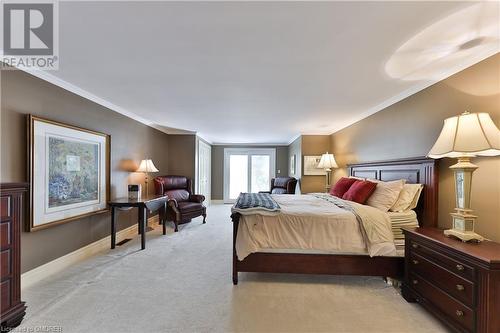 Carpeted bedroom featuring crown molding - 218 Northshore Boulevard W, Burlington, ON 