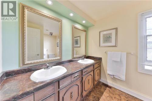 Bathroom featuring tile patterned flooring, vanity, and toilet - 218 Northshore Boulevard W, Burlington, ON 