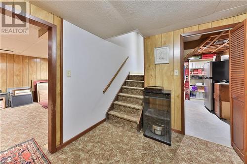 Staircase with concrete flooring and wooden walls - 218 Northshore Boulevard W, Burlington, ON 