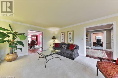 Living room featuring hardwood / wood-style floors and crown molding - 218 Northshore Boulevard W, Burlington, ON 