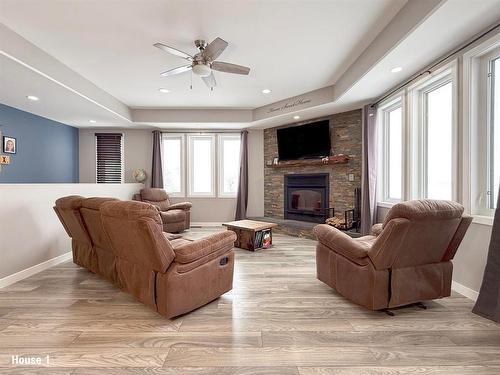 130049 29 Avenue N, Hartney, MB - Indoor Photo Showing Living Room With Fireplace