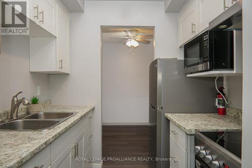 306 - 25 College Street E, Belleville, ON - Indoor Photo Showing Kitchen With Double Sink