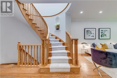 Stairway with hardwood / wood-style floors and ornamental molding - 2303 Hill Ridge Court Unit# 10, Oakville, ON 