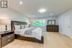 Bedroom featuring light hardwood / wood-style floors - 