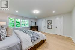 Bedroom with light hardwood / wood-style floors - 