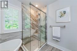 Bathroom featuring separate shower and tub - 