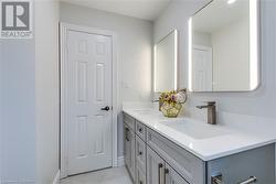 Bathroom with vanity and tile patterned flooring - 