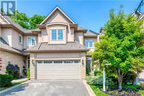 View of front of house with a garage - 2303 Hill Ridge Court Unit# 10, Oakville, ON 