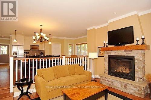 8-2 - 532 10Th Concession Road, Westport, ON - Indoor Photo Showing Living Room With Fireplace