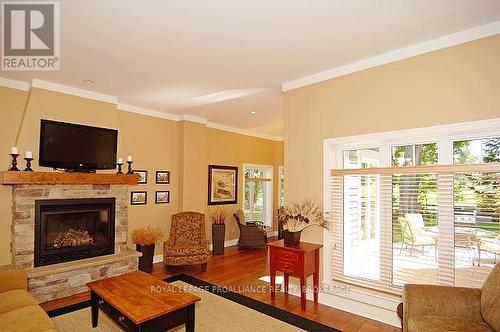 8-2 - 532 10Th Concession Road, Westport, ON - Indoor Photo Showing Living Room With Fireplace