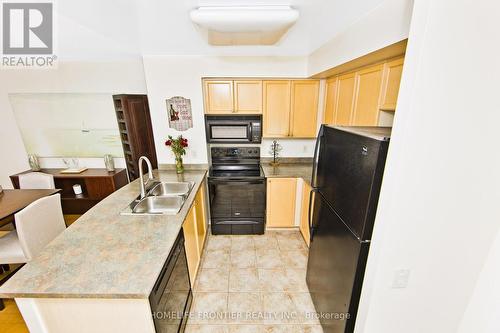 815 - 25 Kingsbridge Garden Circle, Mississauga, ON - Indoor Photo Showing Kitchen With Double Sink