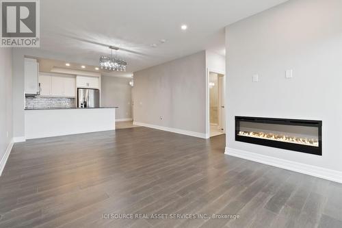 706 - 1880 Gordon Street, Guelph, ON - Indoor Photo Showing Living Room With Fireplace